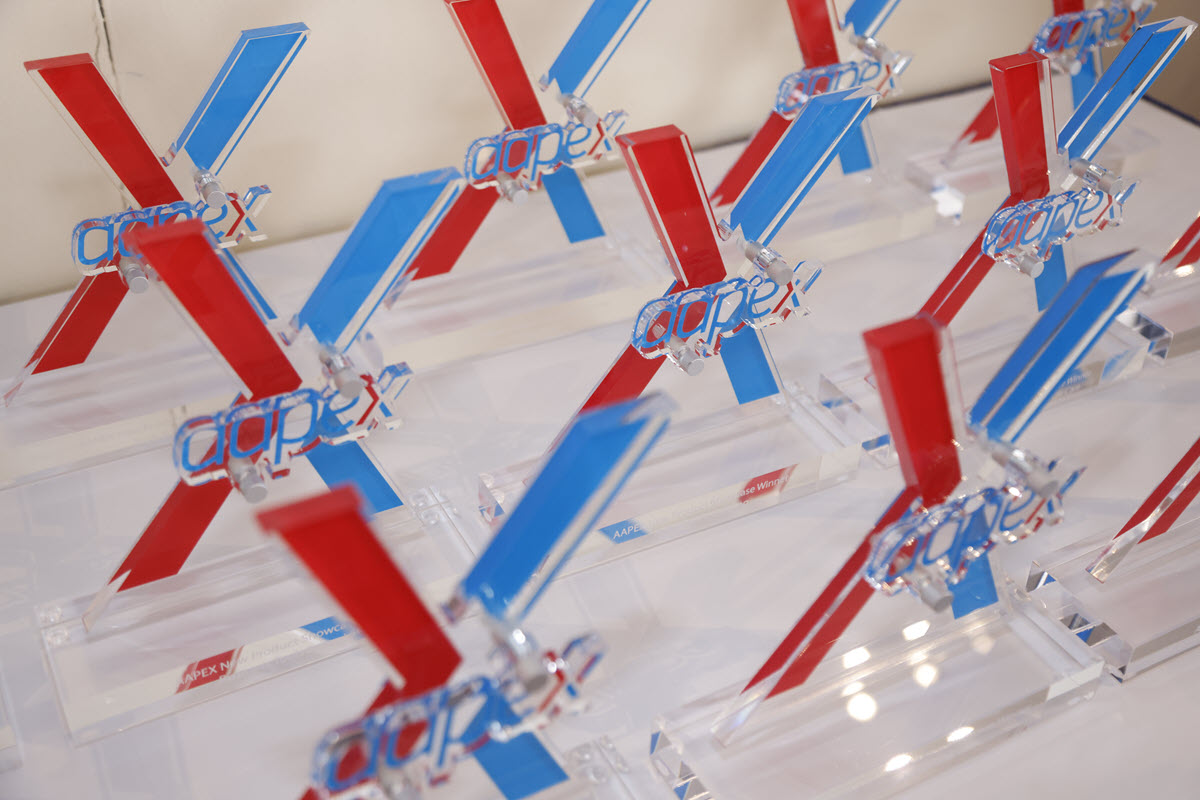 Rows of AAPEX award trophies