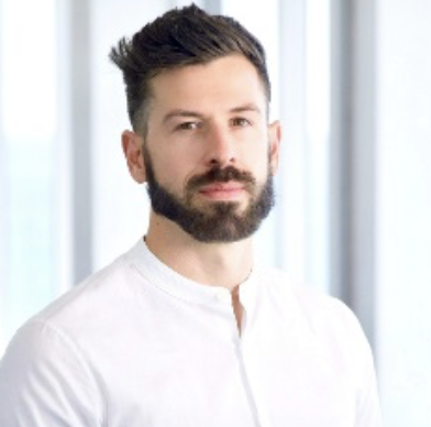 Headshot of Sebastian Zelger wearing a white shirt
